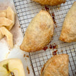 Load image into Gallery viewer, Purchase the ready to bake Apple Turnovers from the Flaky Apple Pie Company and wow all our friends with your baking skills this Holiday Season.