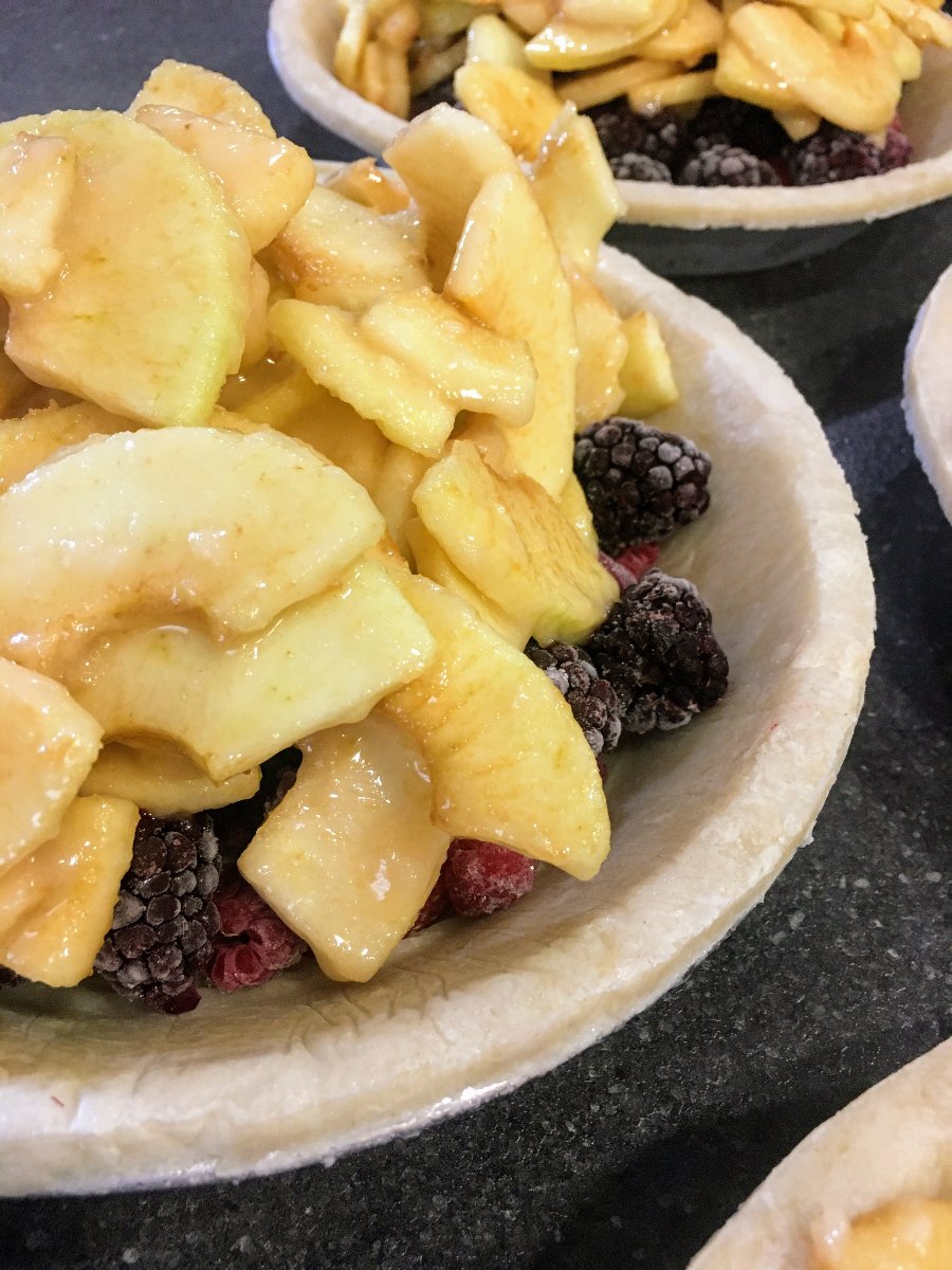Make Thanksgiving a breeze with our ready-to-bake Triple Berry Apple Crumb Pie from Flaky Apple Pie Company. Delight your friends and family with this effortless, delicious holiday treat!
